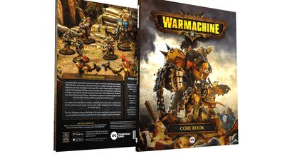 A hardcover rulebook for Warmachine is prominently displayed, featuring a striking cover with a large, armored warjack on the front. The back cover showcases a group of detailed miniatures in a rocky terrain, depicting various warcasters and constructs engaged in battle. Text highlights the core themes of the game, including its rich lore and the ongoing conflict in the Iron Kingdoms, while the spine of the book is labeled "CORE BOOK."
