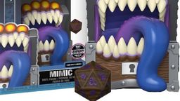 A Funko POP collectible features a Dungeons and Dragons Mimic designed as a treasure chest with a wide, gaping mouth filled with sharp teeth and a long, purple tongue. The Mimic is brightly colored, with orange accents on top, and is accompanied by a D20 die in front, showcasing intricate designs. The packaging displays the Funko logo and the number "423," indicating its series.