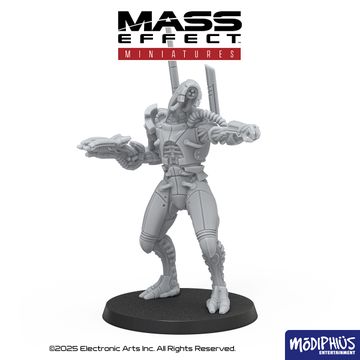 A detailed gray resin miniature from the Mass Effect universe stands on a circular black base, depicting a humanoid figure with a sleek, armored design. The figure features intricate mechanical details, including visible joints and a raised arm holding a weapon, suggesting a combat-ready stance. The Mass Effect logo is prominently displayed at the top, along with the Modiphius Entertainment branding at the bottom.