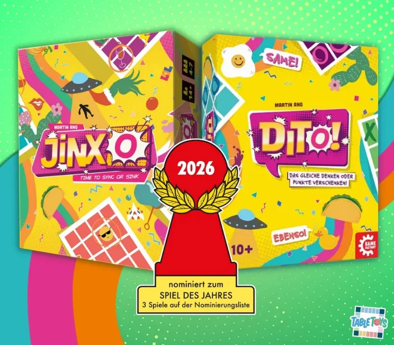 Two colorful game boxes titled "JINX O" and "DITO!" by Martin Ang, with vibrant illustrations including tacos, UFOs, and confetti. Between them is a red trophy with a gold laurel wreath and the year "2026" at the top. Below the trophy, a yellow banner reads "nominiert zum SPIEL DES JAHRES 3 Spiele auf der Nominierungsliste". The background is green with polka dots.