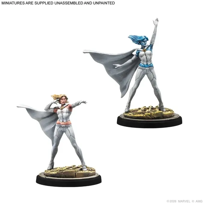 Two unpainted miniatures of female superheroes with capes on circular bases.