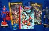 Justice League Unlimited RPG books, Crisis Protocol, The Watchtower, and a blue d20 die.