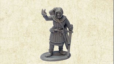 A grey resin miniature of the Master Fletcher stands on a circular base, depicted in a friendly pose with one hand raised in a gesture. He is dressed in a hooded cloak and tunic, with a quiver of arrows slung over his shoulder and a sword at his side. The background features a textured, light-colored surface that enhances the focus on the figure.