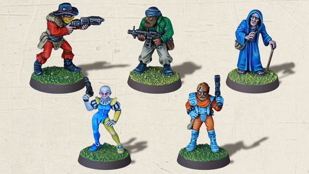 Five detailed miniatures are displayed on circular bases with grassy textures. The characters include a bearded figure in a green jacket holding a rifle, a cloaked figure with a staff, a humanoid with a colorful costume and a pistol, a character in an orange jumpsuit wielding a blaster, and a figure in blue attire. Each miniature showcases intricate paintwork, highlighting their unique features and poses.