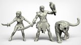 A set of three fantasy miniatures features a muscular male hero wielding a sword and holding a falcon, alongside a svelte female character brandishing a dagger. Both figures are depicted in a dynamic pose, showcasing intricate details in their clothing and accessories, reminiscent of 80s high-fantasy cinema. The miniatures are presented in a light gray color, highlighting their sculptural features.
