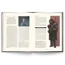 Open book with text and an illustration of a person in red armor.