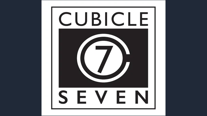 The image features the logo of Cubicle 7, a tabletop role-playing game publisher. The design is a square with a black background, prominently displaying the words "CUBICLE" at the top and "SEVEN" at the bottom in white capital letters. In the center, there is a circular emblem with the number "7" in a bold, stylized font, surrounded by a thin white ring. The overall aesthetic is clean and modern, emphasizing the brand's identity in the gaming community.