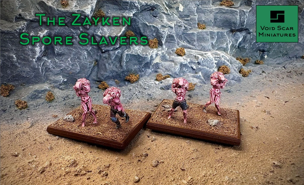 Three Zayken Spore Slaver miniatures are displayed on textured brown bases, set against a rocky backdrop. The miniatures are grotesque, with pinkish skin and bulbous heads featuring multiple eyes, emphasizing their monstrous appearance. The text 