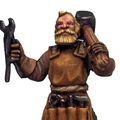 A detailed miniature figure of a bearded blacksmith, holding a wrench in one hand and a hammer in the other. He is dressed in a brown tunic with a tool belt, showcasing various tools. The figure has a rugged appearance, with a determined expression, embodying the essence of a fantasy tavern character.