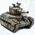 A detailed model of a mechanized tank, featuring a rugged green exterior with weathering effects and patches of foliage. The tank has a prominent turret with a large cannon, adorned with a colorful muzzle, and a smaller machine gun mounted on top. Various markings, including a number "5" and a stylized "V," are visible on the tank's surface, enhancing its sci-fi aesthetic.