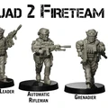 Four detailed miniature figures are displayed, representing members of Squad 2 Fireteam Alpha. From left to right, they include a Fire Team Leader holding a rifle, an Automatic Rifleman with a larger weapon, a Grenadier equipped with a grenade launcher, and a Marksman aiming with a scoped rifle. Each figure is posed dynamically and features modern military gear, showcasing the extensive research behind their design.