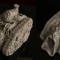 A pair of intricately designed demonic tanks, sculpted in a pale material, showcase a grotesque aesthetic with various orifices, boils, and eyeballs adorning their surfaces. One tank features a prominent, gaping mouth at the front, while the other has a twisted, organic form with tendrils and textures that evoke a visceral, chaotic feel. Both vehicles are set against a dark background, emphasizing their unsettling details and unique design suitable for a Chaos army.