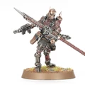 A detailed miniature figure of a Goremonger stands on a textured base adorned with tufts of grass. The figure features a muscular build, wearing a mix of armor and leather, with a menacing mask and spikes on the head. In one hand, it wields a large, jagged weapon, while a firearm is slung across its body, showcasing a gritty, post-apocalyptic aesthetic.