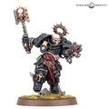 A Black Templars Execrator stands in a dynamic pose, wielding a large, ornate power hammer in one hand and a pyre pistol in the other. The figure is clad in black armor adorned with gold and silver details, including a skull motif on the helmet and a purity seal on the chest. The base features a grassy terrain with scattered skulls, enhancing the grim aesthetic typical of the Warhammer 40,000 universe.