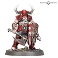 A muscular warrior stands prominently, adorned in red and black armor with sharp spikes and skull motifs. He wields a large, menacing axe in one hand and a shield with jagged edges in the other, both showcasing intricate detailing. His head is covered by a horned helmet, and he stands on a rocky base with sparse grass and skulls scattered around.