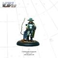 A detailed miniature figure of a Commando Sergeant stands on a textured black base, holding a flamethrower in one hand and a chain gun slung over her shoulder. She wears a tactical outfit with a fitted top and cargo pants, complemented by a wide-brimmed hat. The figure is painted in shades of green and gray, with a hint of yellow in her hair, set against a light grid background.