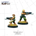 Two miniature commandos are depicted in an action pose, ready for combat. The first commando, on the left, is crouched and holding a futuristic weapon, while the second, on the right, stands confidently with a larger firearm. Both figures are detailed with tactical gear and are set against a simple grid background, with tufts of grass on their bases.