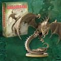 A detailed miniature of an adult dragon is prominently displayed, showcasing its intricate scales, fierce expression, and large, outstretched wings. The dragon is coiled around a rocky base, with its tail elegantly curved. In the background, a box labeled "DRAGONBANE" is visible, indicating the miniature's association with the Dragonbane RPG, set against a textured green backdrop.