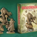 A collection of five detailed RPG miniatures from the Dragonbane Hero Set, featuring a variety of characters including a lion-headed figure, a cloaked wizard, and a female archer, all posed dynamically. The miniatures are displayed in front of a box labeled "DRAGONBANE" with artwork depicting a fantasy scene. The background is a textured green, enhancing the fantasy theme of the set.
