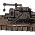 A large, detailed artillery piece is mounted on a flat, rectangular platform with a textured surface. The cannon features a prominent barrel with black and white stripes, a complex mechanical structure, and a staircase leading up to it. The platform is designed with industrial elements, including various panels and lights, emphasizing a grimdark aesthetic suitable for a sci-fi tabletop setting.