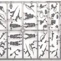 A sprue featuring multi-part figures of British and Canadian winter infantry, showcasing six distinct soldier poses, all equipped with various winter gear. The sprue includes an assortment of weapons such as rifles, machine guns, SMGs, and specialist items like sniper rifles, mortars, and flamethrowers, along with engineering tools like shovels and mine sweepers. The figures are intricately detailed, emphasizing their readiness for winter conditions.