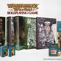 A collection of Warhammer: The Old World roleplaying game products is displayed, featuring several books and accessories. Prominently shown are the core rulebook, a player's guide, and a collector's edition, all adorned with intricate artwork. Additionally, there are packs of cards, a character sheet pad, and various dice, emphasizing the comprehensive nature of the available bundles.