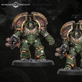 Two imposing Space Marine dreadnoughts stand side by side, showcasing intricate details and a striking green armor adorned with gold accents. Each dreadnought is equipped with a powerful weapon in one hand, featuring a fiery muzzle, while their other arms are armored and decorated with the iconic Aquila symbol. The backdrop is a dark, textured surface with faint maps and symbols, enhancing the dramatic presentation of these new miniatures.