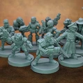 A collection of 28mm scale sci-fi miniatures features various characters, including a Space Commando, a Starchild, an Assault Goar, a Space Orc, and a Voidborn, all sculpted in a retro style reminiscent of the Rogue Trader era. The miniatures are displayed in a group, showcasing their unique designs and details, with some holding weapons and others in dynamic poses. The figures are unpainted and cast in a light gray material, set against a brown background.