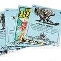 A collection of five encounter cards from Philip Reed’s Deck of Old School Encounters series, featuring a light blue background. Each card displays a unique encounter description, including details about hostile creatures like "3D4 Corpse Thieves" and "3D Undead," along with their reactions and behaviors. The top card prominently features the title "DECK OF OLD SCHOOL ENCOUNTERS," while the illustrations depict various fantasy creatures and scenarios relevant to tabletop RPGs.