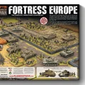 A detailed illustration showcases the "Fortress Europe" starter set for the Flames Of War wargame, featuring a battlefield scene with various military units. In the foreground, a soldier in uniform stands beside a tank, while multiple tanks and infantry figures are arranged across a terrain of fields and barricades. The box cover prominently displays the title "FORTRESS EUROPE" along with images of the included forces, emphasizing the complete World War II starter set.