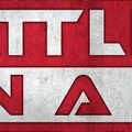 A bold graphic features the text "BATTLEFIELD IN A BOX" prominently displayed in large, stylized letters. The background is a textured red, contrasting with the white and silver elements of the text. The overall design conveys a strong, dynamic feel, suitable for a tabletop gaming context.
