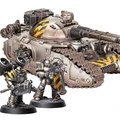 A detailed image features a large, imposing Fellblade super-heavy tank, showcasing a metallic finish with yellow hazard stripes on its turret. Flanking the tank are two MkII Assault Marines, one wielding an axe and the other holding a bolter, both adorned in similar black and yellow armor. The base of the miniatures is textured, enhancing the overall presentation of this Warhammer 40,000 scene.