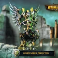 A detailed model of Mortenebra, a Cryx warcaster, stands prominently in the image, showcasing her intricate design. She is adorned with a mix of dark metallic armor and vibrant green accents, with large, menacing wings extending from her back. The background features a blurred industrial setting, enhancing the steampunk aesthetic, while a banner at the bottom reads "MORTENEBRA PERFECTED."