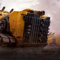 A large, heavily armored vehicle dominates the foreground, painted in a striking yellow with black accents. The vehicle features multiple gun barrels protruding from the top and a rugged, industrial design, emphasizing its role in combat. In the background, additional similar vehicles are partially visible, set against a smoky, war-torn landscape.