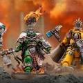 Three dynamic Space Marine miniatures are prominently displayed against a fiery, apocalyptic backdrop. On the left, a figure clad in dark armor with intricate details and a skull motif stands atop a rocky base, holding a weapon. In the center, a green-armored character wields a flaming sword and features a distinctive circular emblem above his head, while flames lick at his feet. On the right, a yellow-armored Space Marine, adorned with a shield and a hammer, exudes a commanding presence, completing the trio of characters from the Warhammer 40,000 universe.