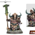 A detailed miniature of a Zharrdron warrior stands prominently, showcasing intricate armor adorned with spikes and dark metallic hues. The figure wields a large, ornate staff topped with a green, glowing emblem, and features a helmet with prominent horns, emphasizing its imposing presence. The base is textured with rocky elements, enhancing the character's fierce and industrial aesthetic.