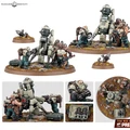 A group of miniatures from the Leagues of Votann is depicted, featuring a mix of humanoid figures and robotic elements. In the center, a large, cylindrical robot stands alongside smaller, stocky figures with mechanical arms, engaged in what appears to be maintenance or operation of equipment. The scene is set on a textured base with rocks and tufts of grass, enhancing the sci-fi aesthetic of the models. Various components, including a small drill and a crate, are also visible, adding to the detail of the display.