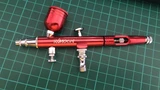 kkmoon airbrush in anodised red on a cutting mat