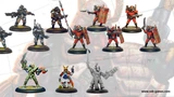 A collection of miniature figures showcases two new additions to the webshop. The top row features several armored warriors, including a fierce warrior from the Leviathan Classic Range, who channels Earthpower, and multiple Convict Auxilia in red armor, equipped for close combat. The bottom row includes a diverse array of characters, such as a figure in green with a bow, a samurai-inspired warrior, and a gray figure wielding a large weapon, all set against a subtle background.