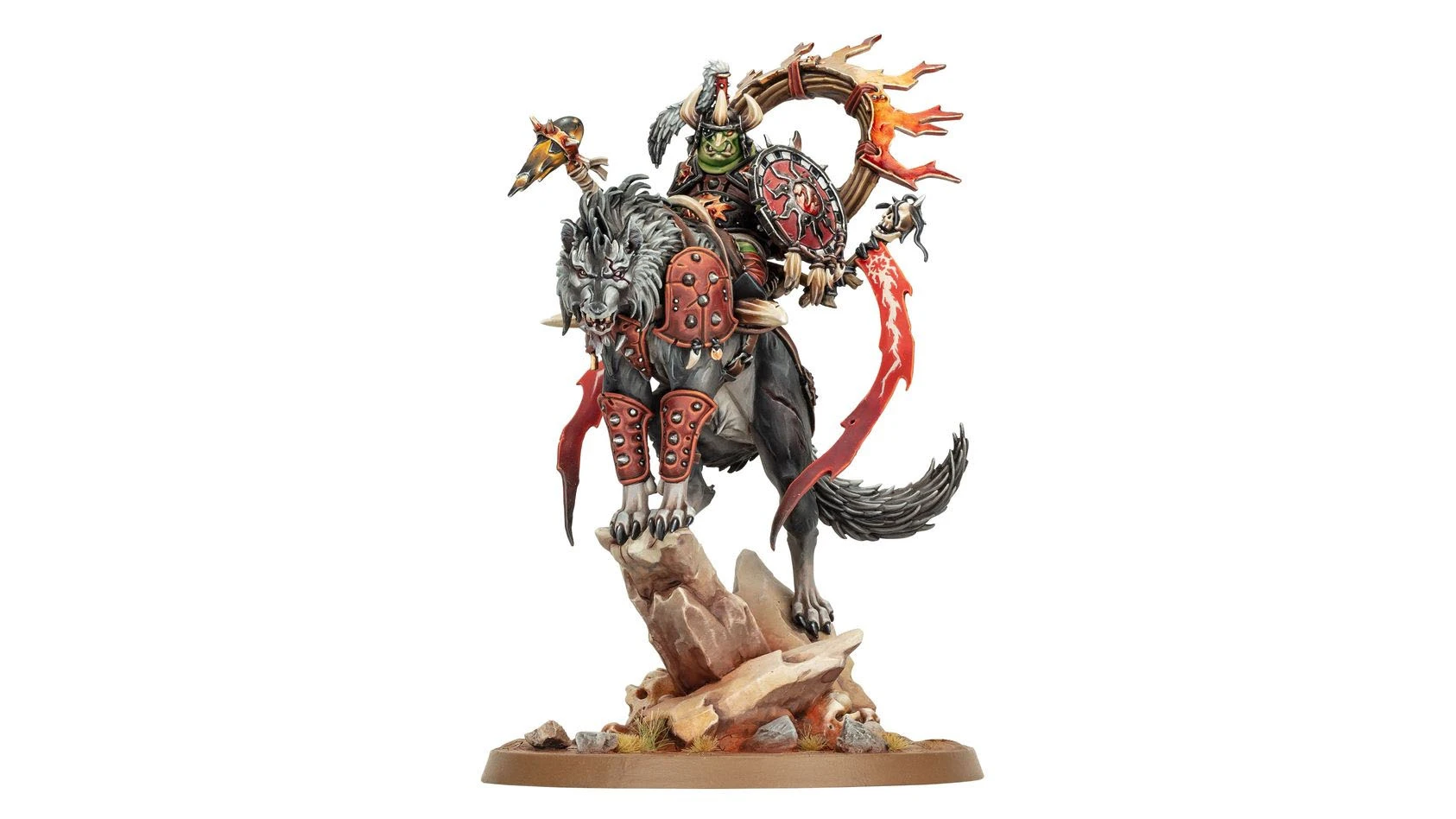 A goblin leader named Droggz da Sunchompa rides a large, fierce wolf, both positioned atop a rocky base. The goblin is adorned in armor with red and black details, holding a shield and a weapon, while a large, fiery wheel is mounted behind him. The wolf features a menacing expression and is equipped with armor, emphasizing the dynamic and aggressive nature of this miniature.
