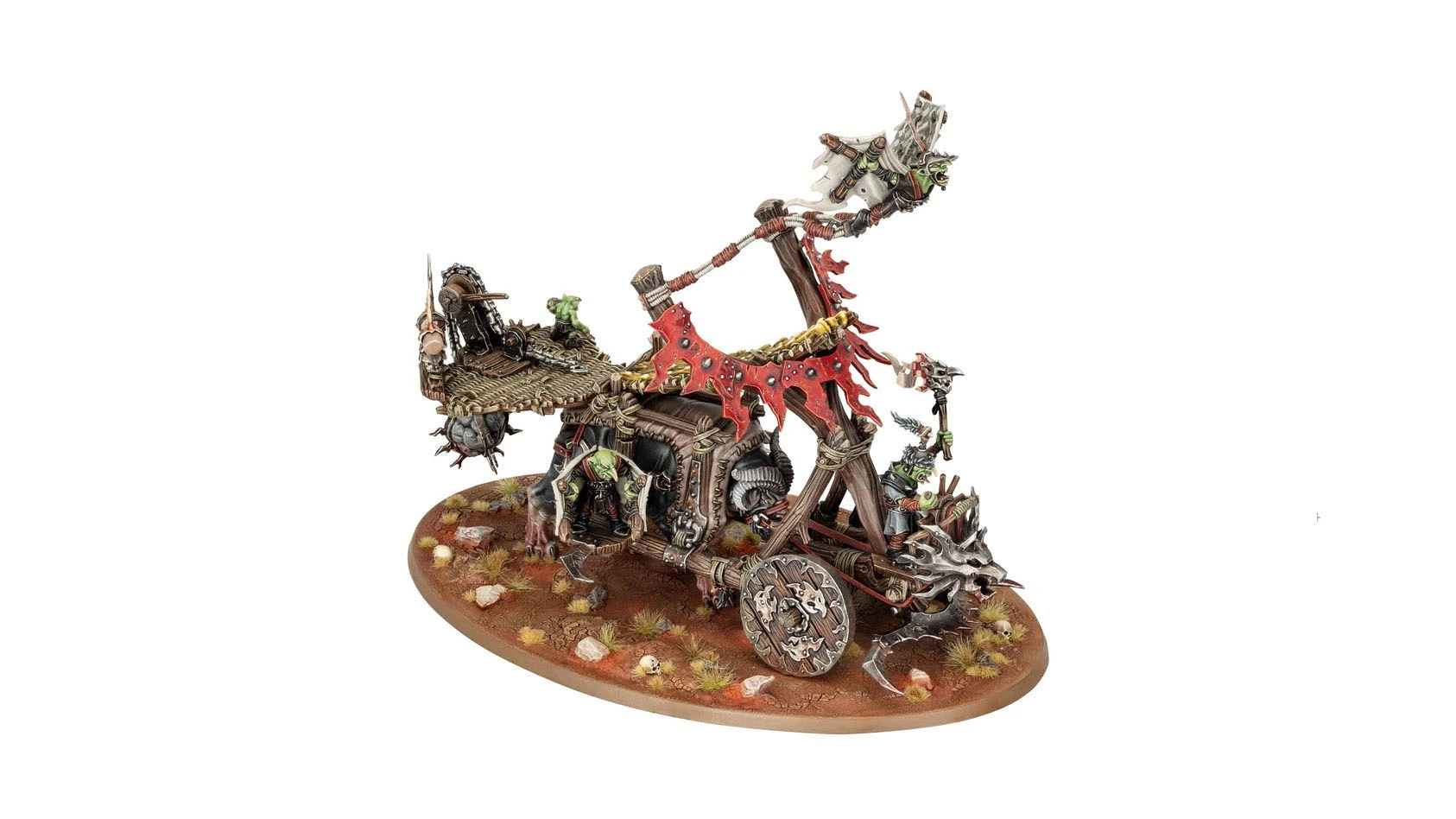 A detailed miniature of a goblin chariot, featuring a wooden structure adorned with tattered red banners and various skull motifs. The chariot is pulled by a skeletal horse, with goblin figures positioned on and around it, one wielding a weapon and another operating a catapult mechanism. The base is textured with dirt, rocks, and tufts of grass, enhancing the overall rugged and battle-worn appearance.