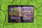 Open book cover for Mutants RPG supplement, showing cracked green background. Title "MUTANTS" in bold yellow letters. Page text includes rules for mutant abilities, combat stats, and descriptions like "Mutant Animals" and "Sewer Scum."