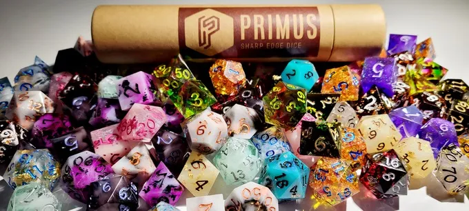 Colorful dice spilled from a cardboard tube, some showing numbers.