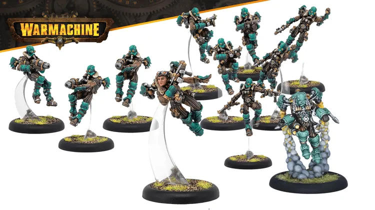 A dynamic group of miniatures from the Crucible Guard expansion for Warmachine, featuring several Rocketmen in mid-flight poses. Each figure is equipped with various weapons and wears a distinctive teal and brown color scheme, complete with goggles and mechanical details. The miniatures are mounted on clear bases, with tufts of grass visible on the black circular bases, enhancing their action-oriented display.