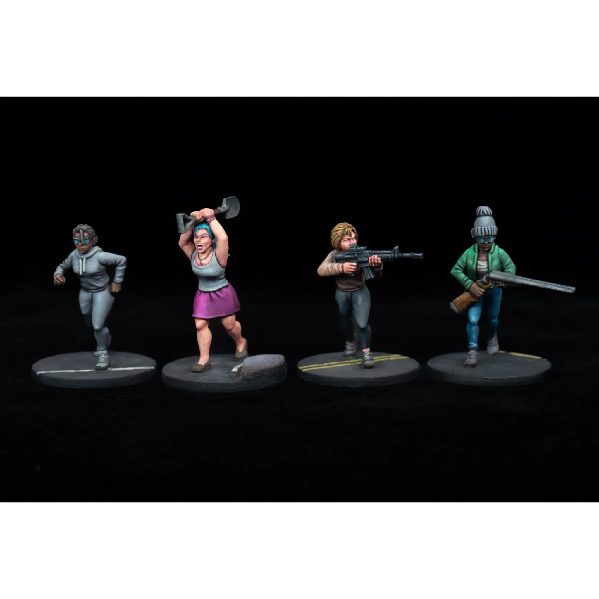 Four miniature figures are displayed against a black background, each representing different characters in a survival scenario. From left to right, a figure in a gray hoodie runs, a woman in a pink skirt wields an axe, a character holds an AR-15, and another figure in a green jacket aims a shotgun. Each figure stands on a circular base, showcasing a variety of poses and expressions that convey urgency and readiness for conflict.