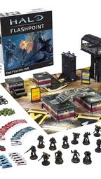 A boxed set for Halo: Flashpoint titled "Feet First into Hell" is prominently displayed, featuring artwork of soldiers in combat. Surrounding the box are 18 detailed miniatures of Orbital Drop Shock Troopers, along with a play mat depicting an urban warzone, several buildings, and various game components including dice, tokens, and cards. The scene is organized, showcasing the miniatures in a dynamic layout, emphasizing the tactical elements of the game.