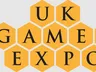 The design features the text "UK GAMES EXPO" arranged in a honeycomb pattern, with each letter placed inside a yellow hexagon. The font is bold and black, creating a strong contrast against the yellow background. The overall layout emphasizes the event's branding in a visually engaging manner.