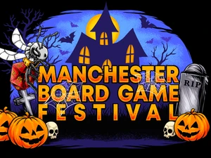 A vibrant graphic features the text "MANCHESTER BOARD GAME FESTIVAL" prominently displayed in bold, orange letters against a dark, spooky backdrop. The scene includes a haunted house with glowing windows, bats flying in the night sky, and various Halloween-themed elements like pumpkins, skulls, and spider webs. The overall atmosphere is festive and eerie, perfectly capturing the Halloween spirit of the event.