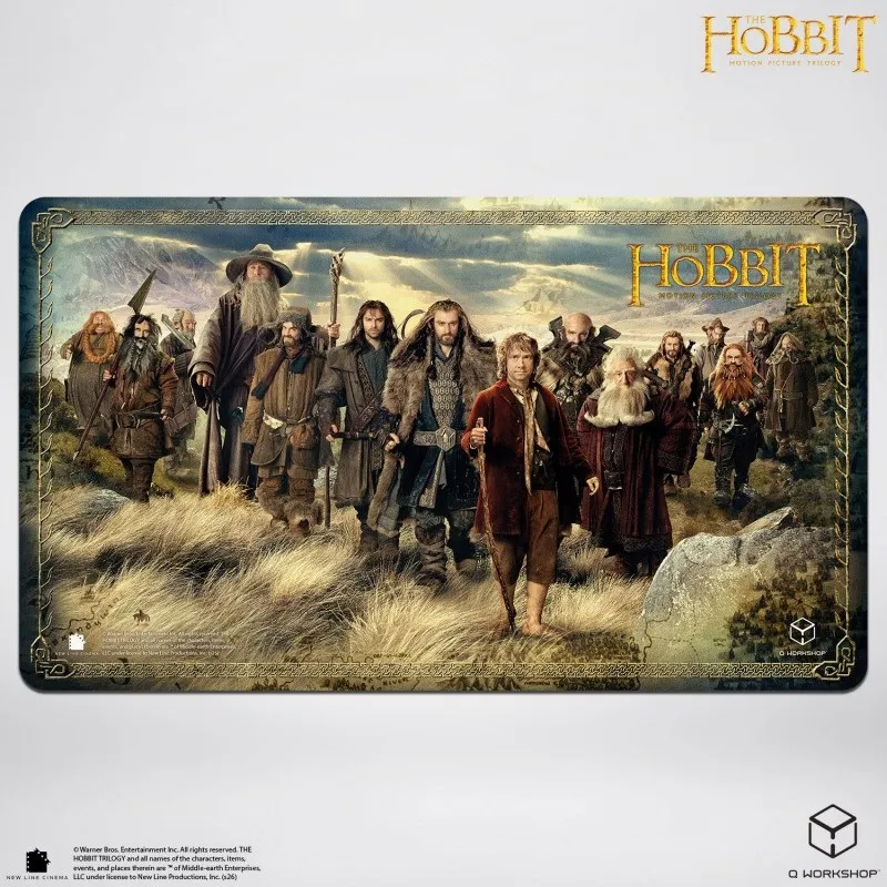 Group of dwarves and Bilbo in a grassy field, "The Hobbit" text above.