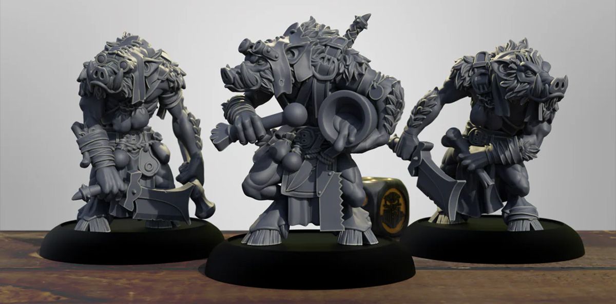 Three intricately designed miniature figures of pig-like warriors stand prominently on a dark circular base. Each figure is heavily armored, adorned with various accessories and weapons, including a sword and a large circular object, suggesting a battle-ready stance. The miniatures are rendered in a gray color, showcasing detailed textures and features, such as fur and armor plating, against a simple wooden surface.